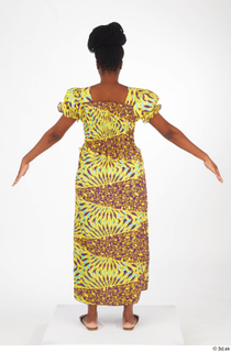 Dina Moses A poses dressed standing whole body yellow long…